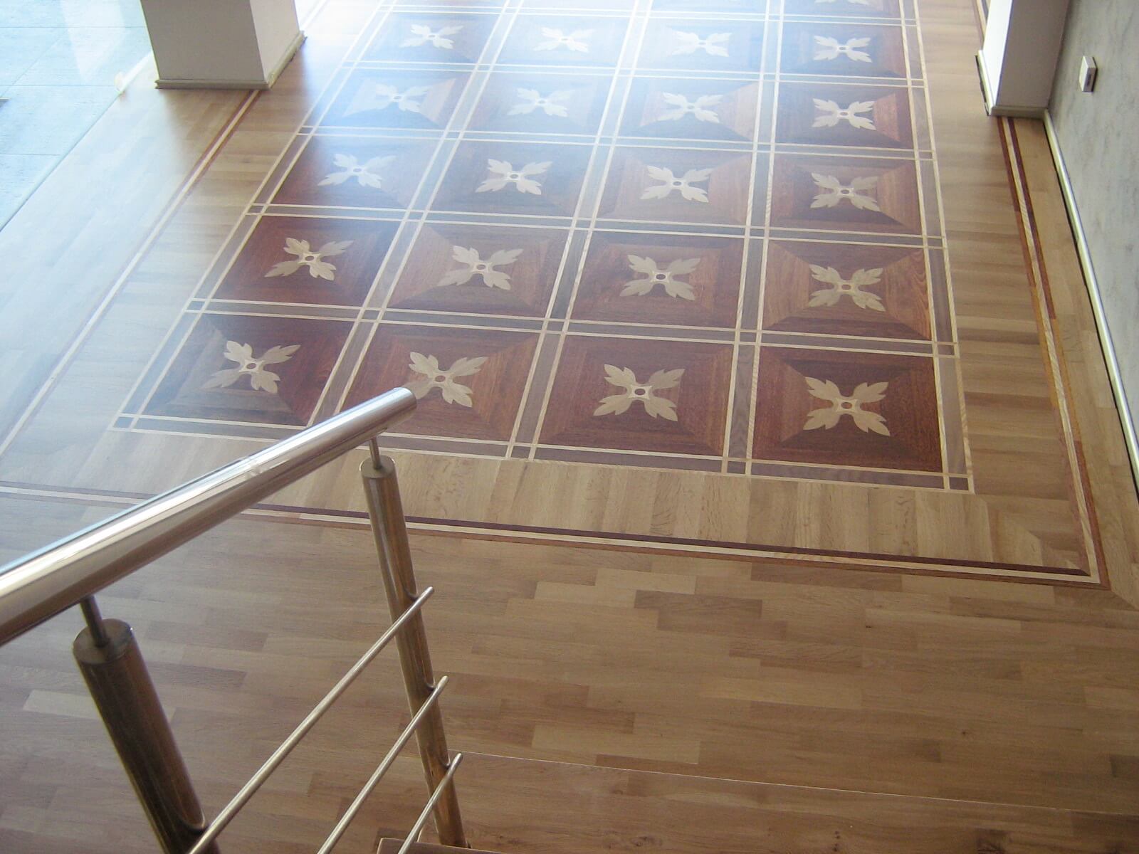 Great combination of traditional oak parquet flooring and art flooring made from ash, wenge and merbau.